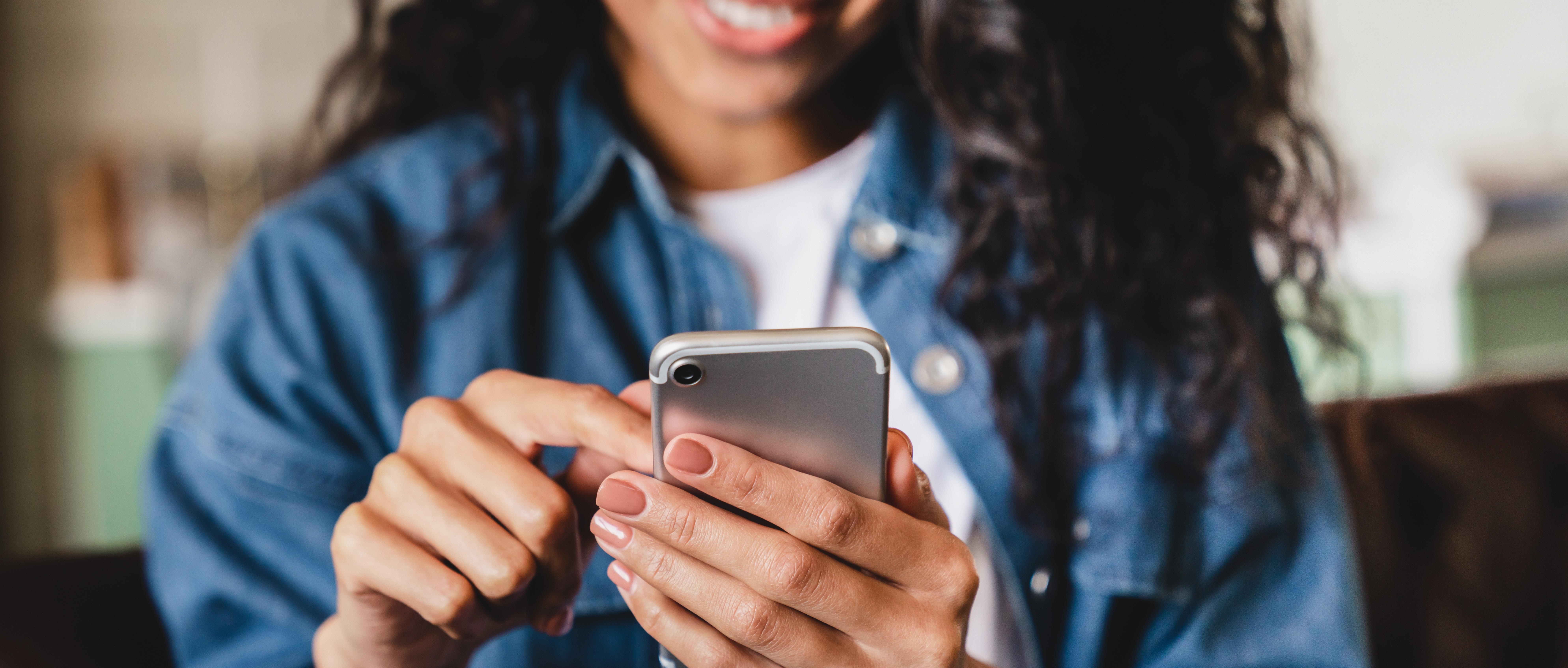 Happy retail customer using a smartphone